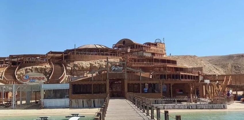Wooden pier leading to the Orange Bay island resort and restaurant on Giftun Island in Hurghada