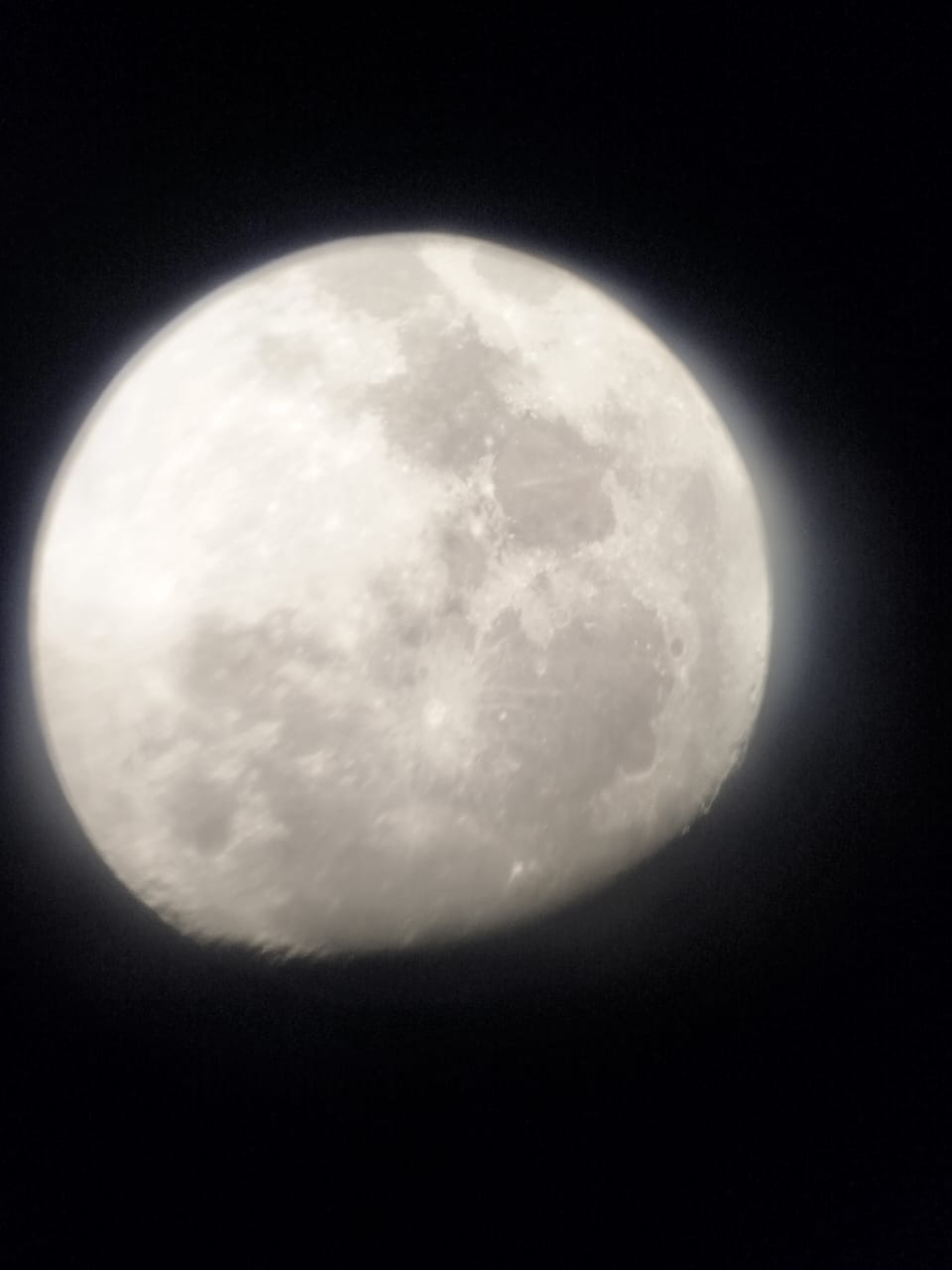Detailed view of the moon surface and craters captured through a telescope during a Stargazing Safari trip